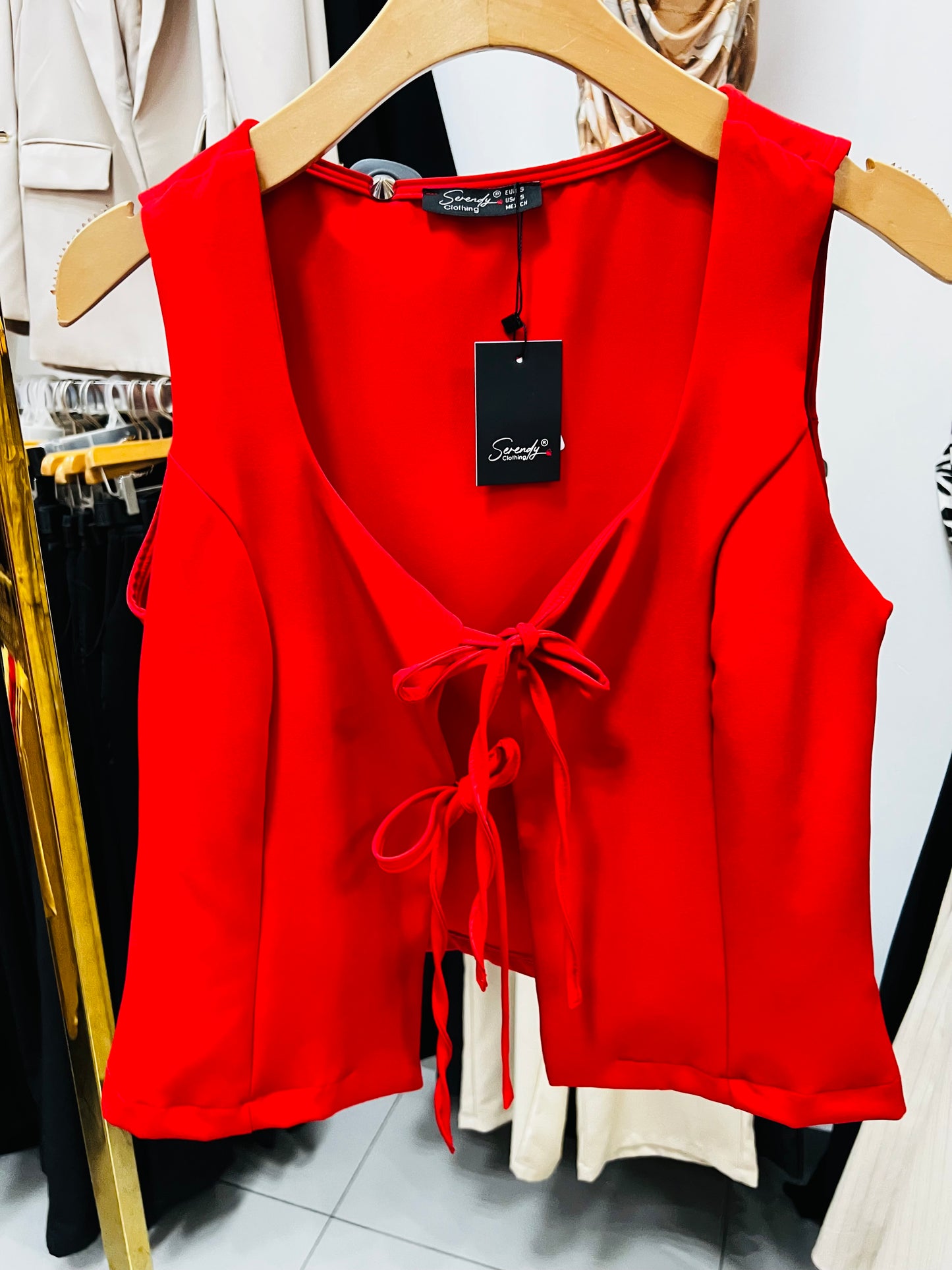 Blusa sin mangas con moños