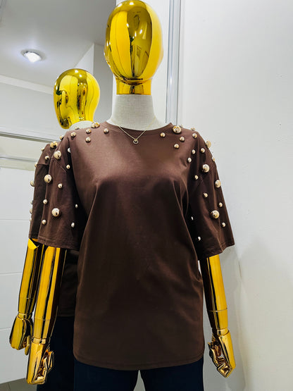 Blusa con perla dorada