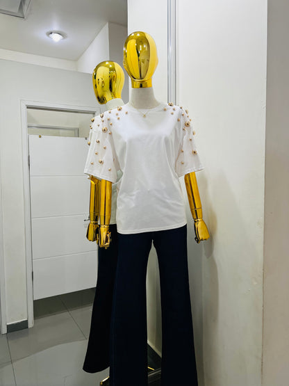 Blusa con detalles dorados