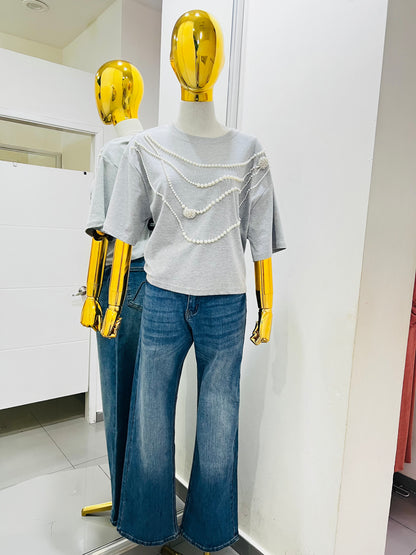 Blusa gris con perlas