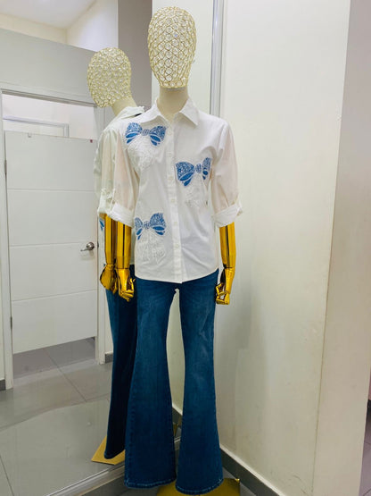 Camisa de moños y piedras