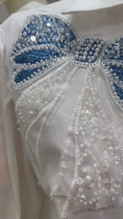 Camisa de moños y piedras